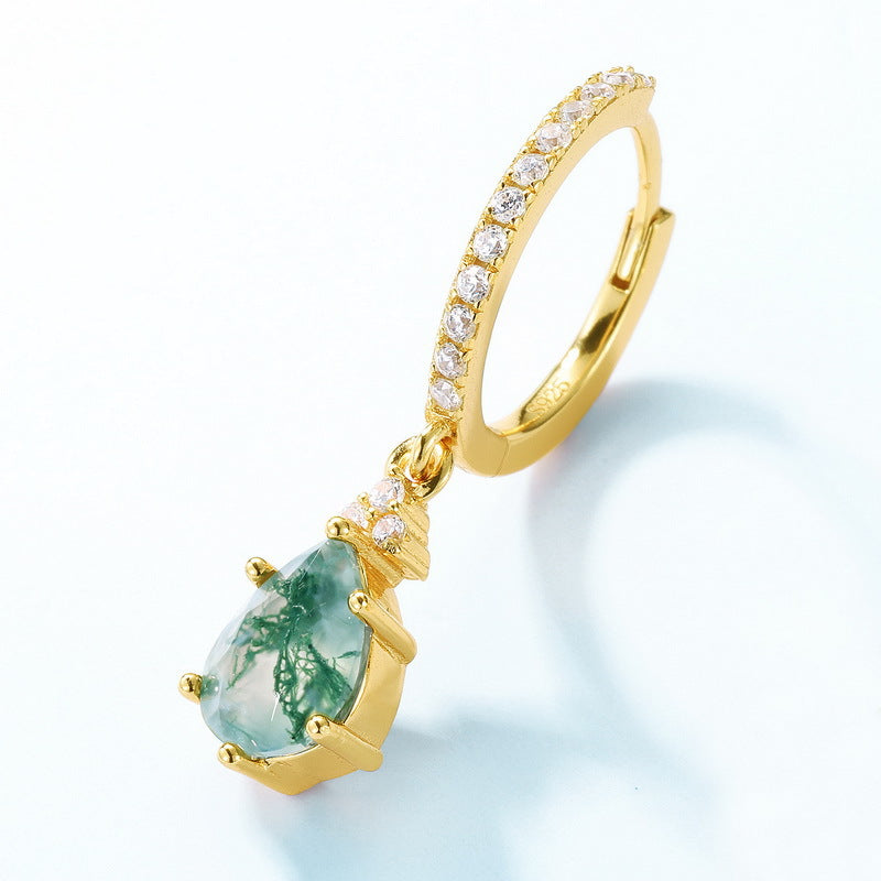 Gold hoop earring: Features a teardrop - shaped moss agate pendant, with crystal - encrusted band, isolated on white.