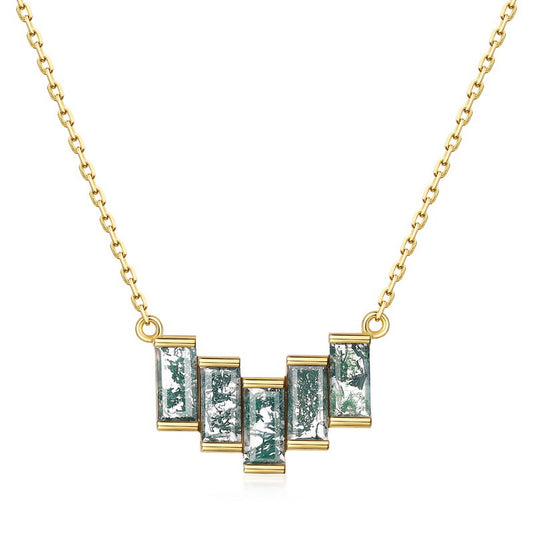 yellow Gold necklace with rectangular green gemstones on a white background