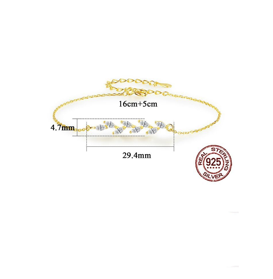 Gold bracelet with measurement details and 'Real Sterling Silver' stamp on a white background