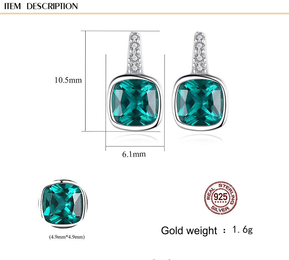 Green gemstone earrings with silver setting, showing dimensions and gold weight on a white background.