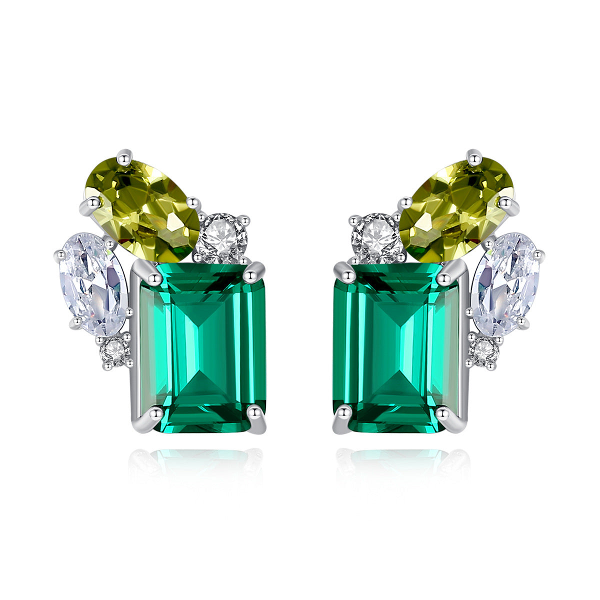 Pair of earrings with emerald peridot and cubic zirconia gemstones on a white background