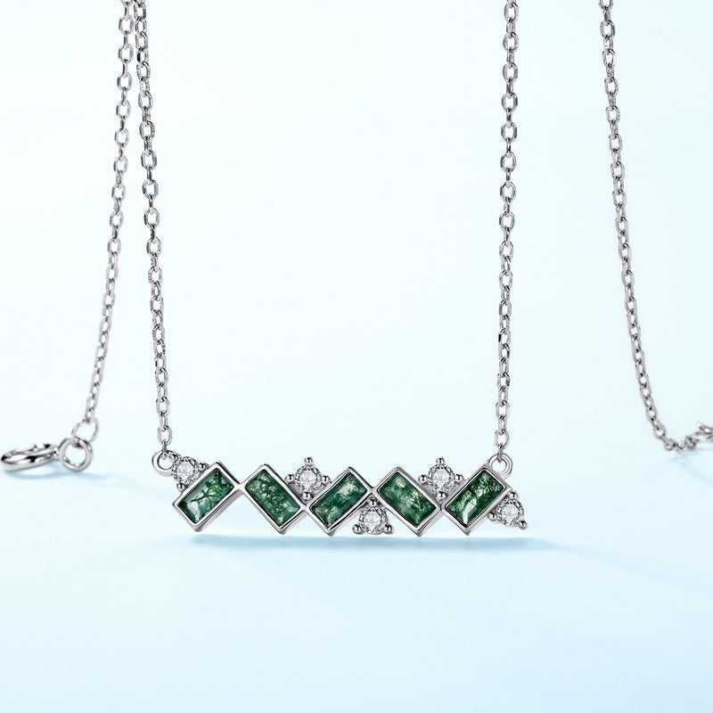 925 sterling Silver necklace: Horizontal pendant, green moss agate stones, clear crystal accents, isolated on white.