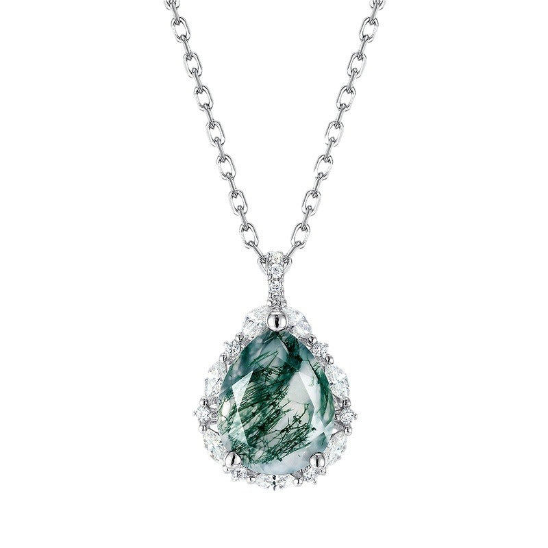 Silver pendant necklace: pear shaped moss agate, surrounded by clear crystals, white background.