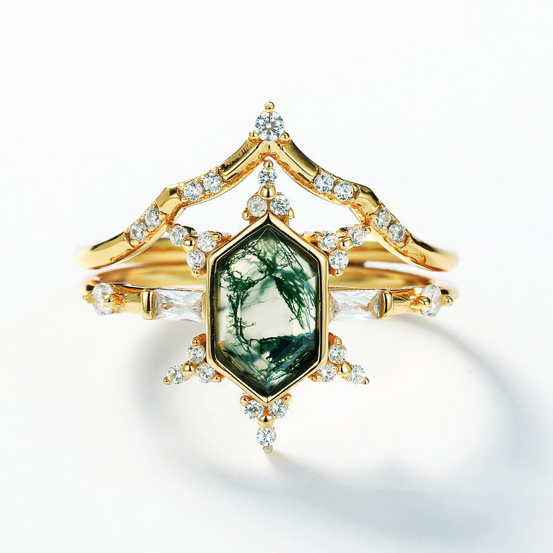 Gold - toned ring set: Hexagonal moss agate ring with multi - layer crystal - studded designs, isolated on white.