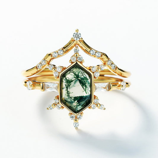 Gold - toned ring set: Hexagonal moss agate ring with multi - layer crystal - studded designs, isolated on white.