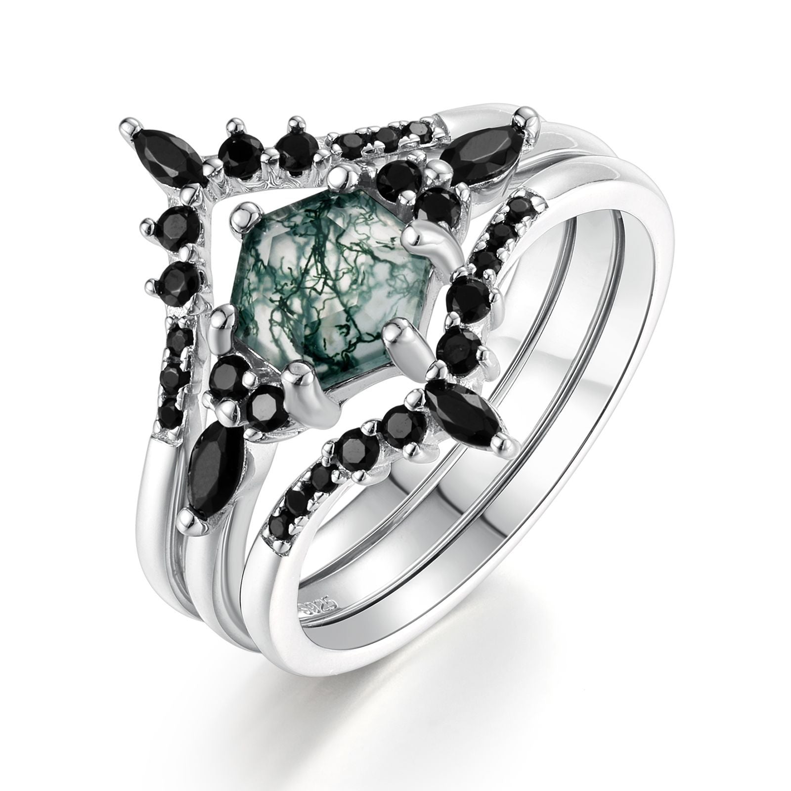 Silver - toned ring set: Hexagonal moss agate ring and two black gemstone - studded rings, isolated on white.