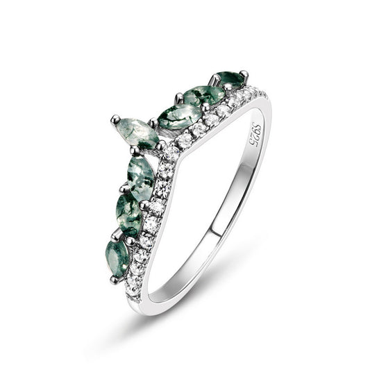Silver ring with curved band: Moss agate stones, cubic zirconia - set edges, isolated on white, showcasing intricate jewelry design