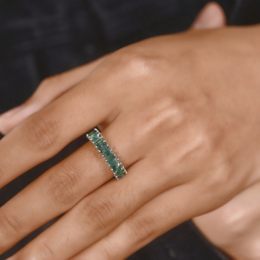 Silver ring with rectangular moss agate stones, worn on a hand, showcasing elegant design for daily wear
