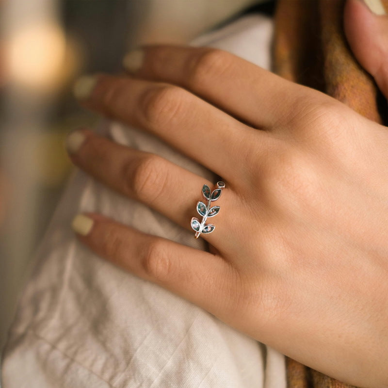 Silver leaf ring with moss agate, worn on a finger, elegant for daily match, highlighting delicate craftsmanship
