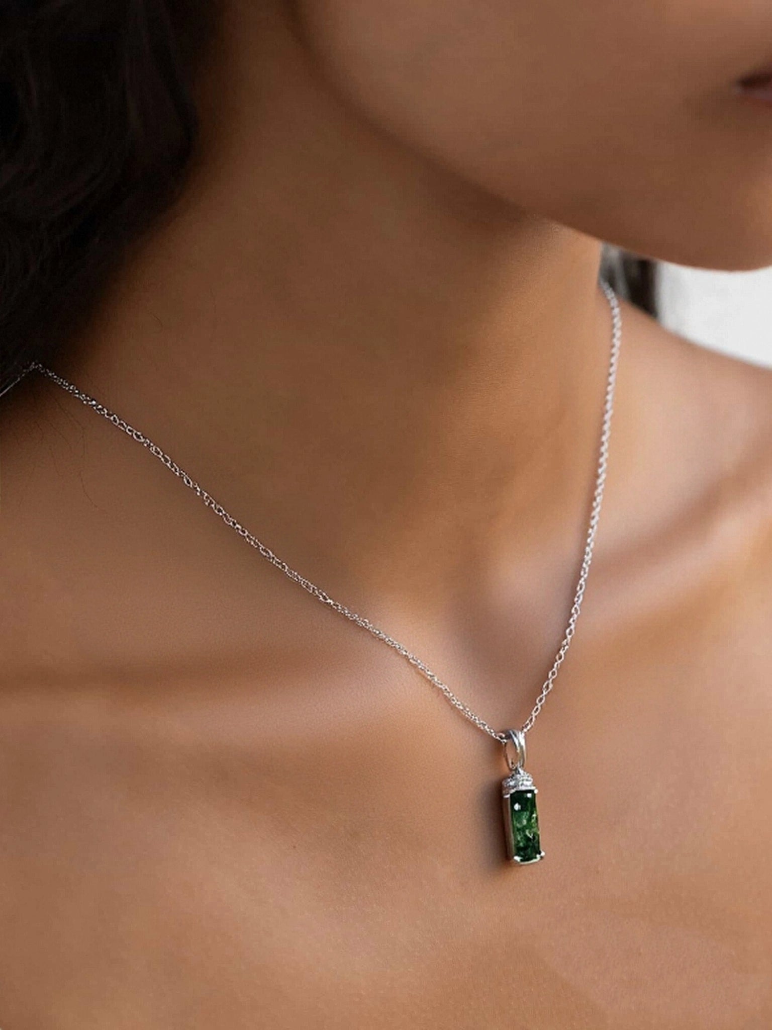 Silver necklace with moss agate pendant, worn on a neck, cubic zirconia details, elegant for daily wear