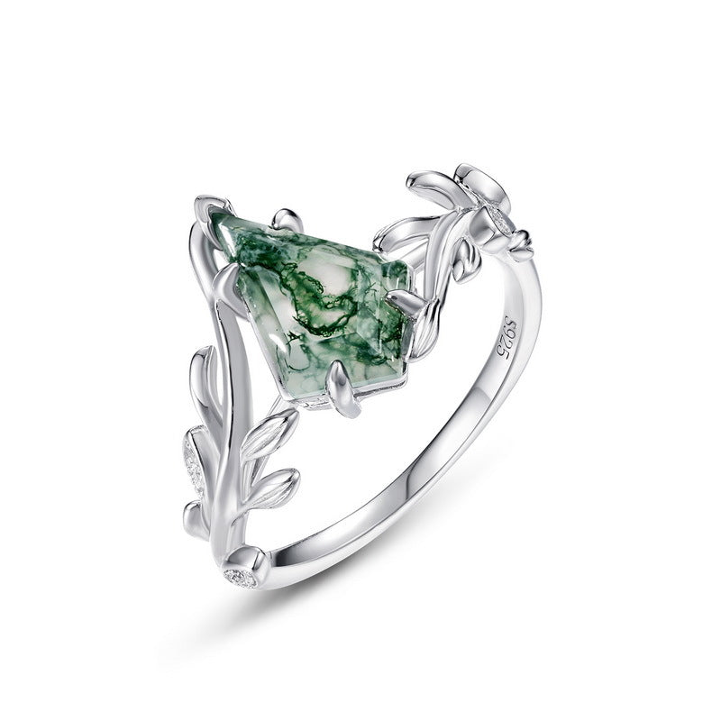 Silver ring: Diamond - shaped moss agate, leaf - branch design with small diamonds, isolated on white.