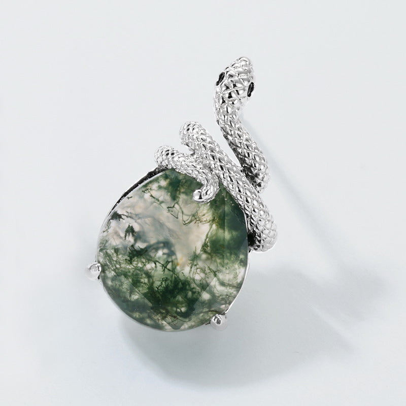 Silver - toned pendant: Snake - wrapped teardrop moss agate, isolated on white.
