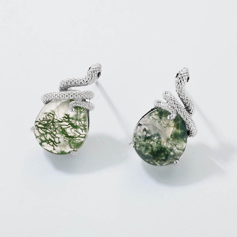 Silver - toned earrings: Snake - wrapped teardrop moss agate, isolated on white.