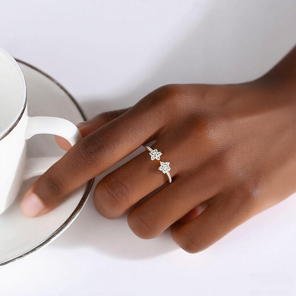 Hand wearing a cubic zirconia ring with a blurred background