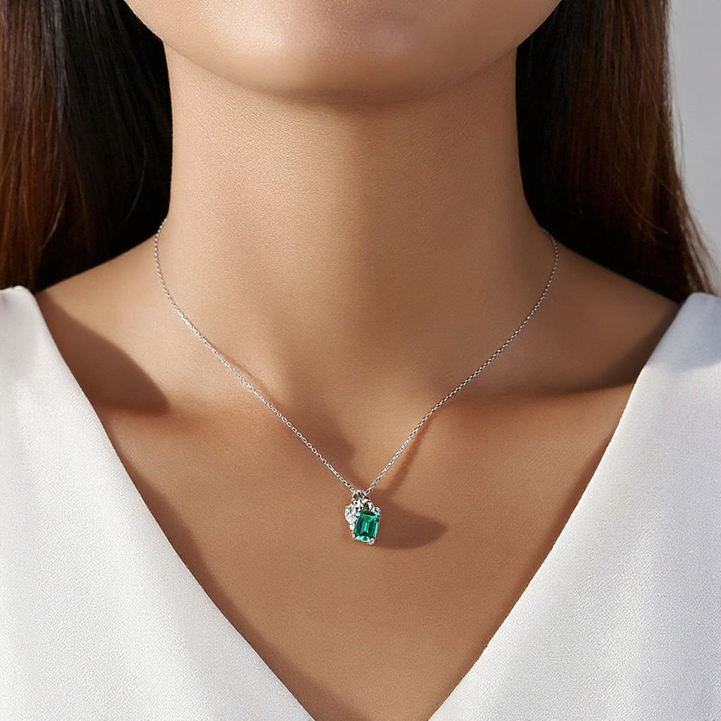 women wearing a silver emerald green CZ necklace