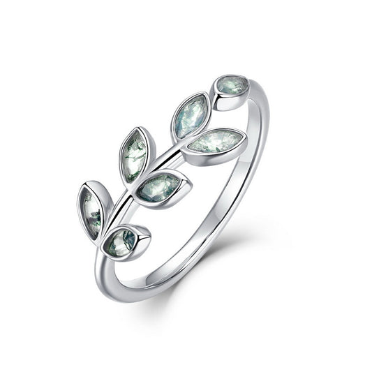 Silver leaf - shaped ring with marquise - cut moss agate stones, showcasing nature - inspired design, isolated on white